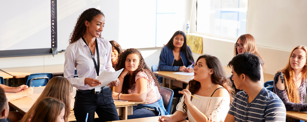 image of instructor talking to college students